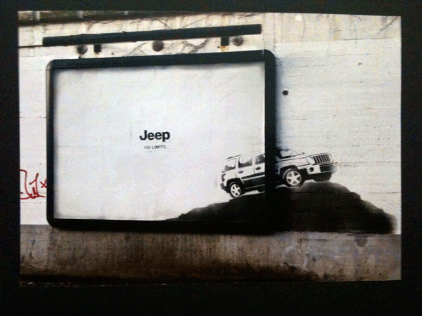 A visceral interpretation of "No limits": a graffiti spray-on Jeep silhouette is seen driving out of a billboard frame